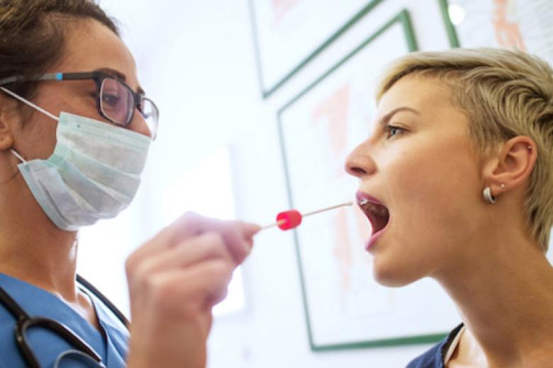 Taking a throat swab
