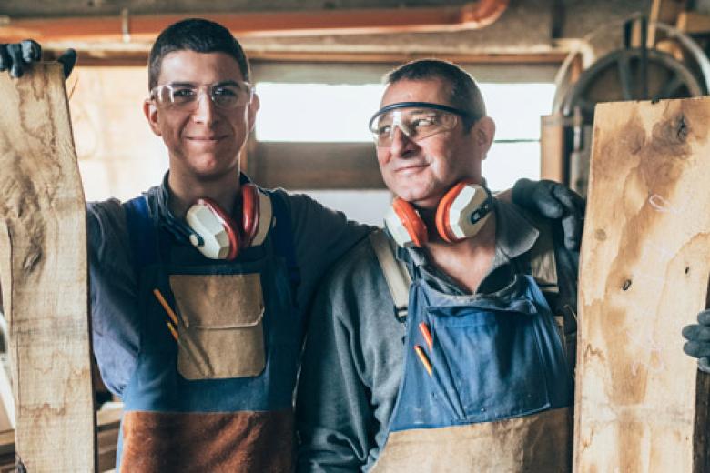 Father and son in their carpenter's workshop