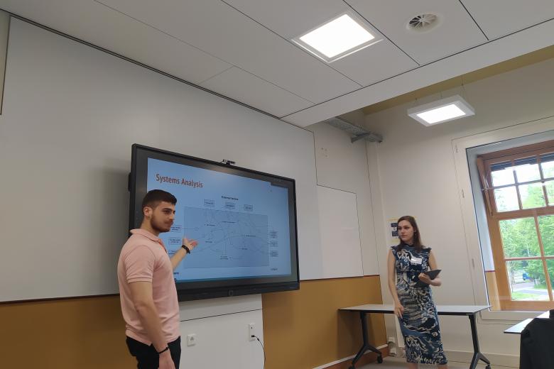 students presenting in a classroom