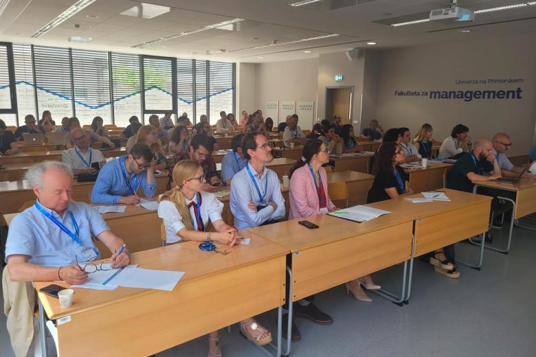 A lecture hall filled with people
