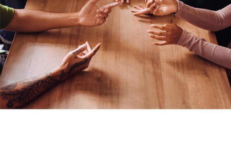 Hands of young people having a discussion