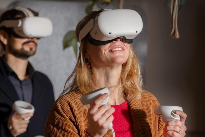 Two researchers looking in VR glasses