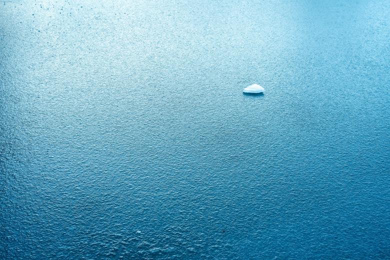 small iceberg in ocean