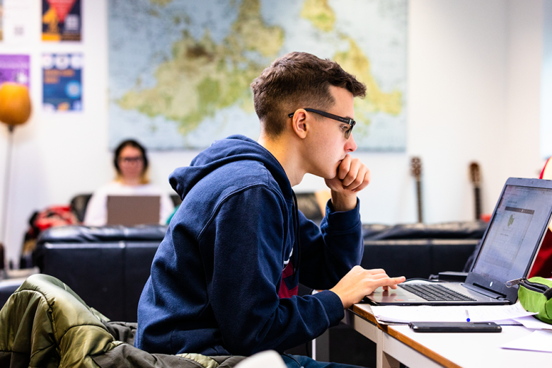 Student looking at laptop