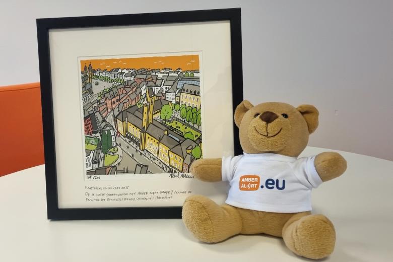 A picture frame and teddy bear to symbolise the collaboration