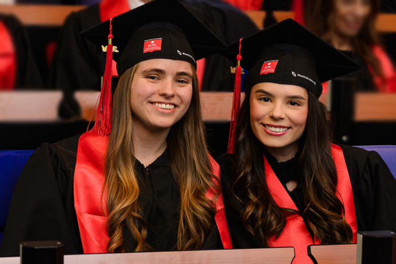Photo of two graduation students of the master