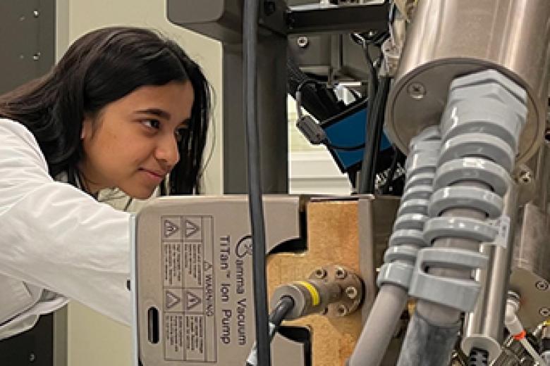 Woman working on machine in the lab