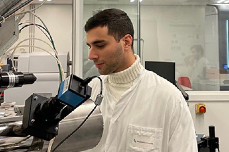 Student in working on machine in the lab