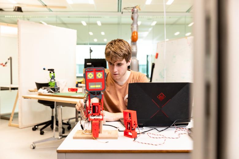 Guy programming robot