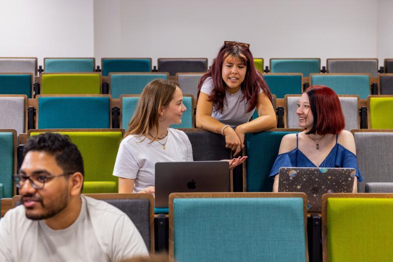 Student chatting in lecture hall
