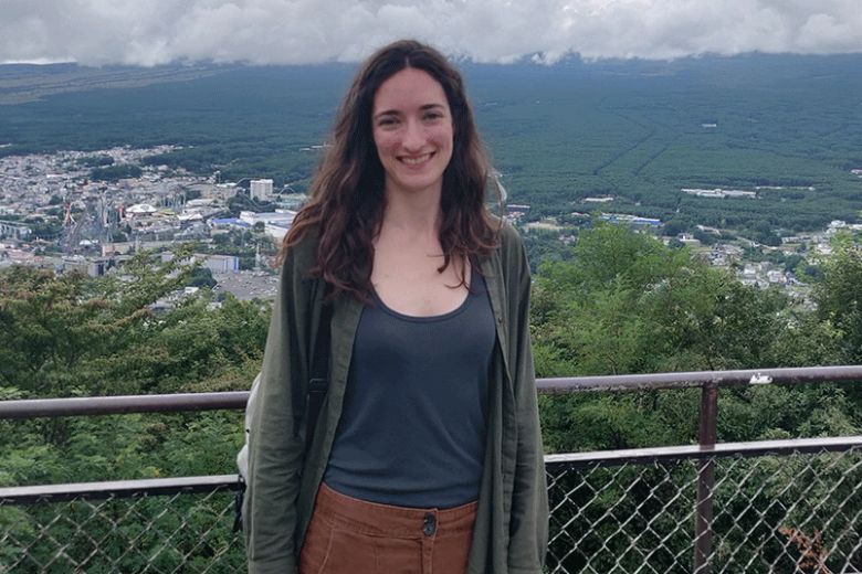 Woman standing in front of panorama