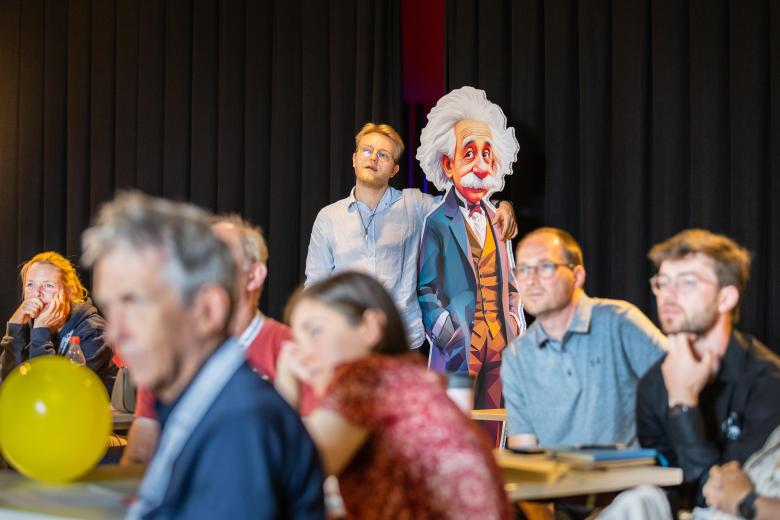 teacher embracing Einstein statue during Magic summer school