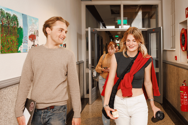 Students walking through hallway