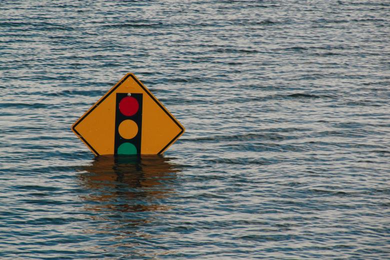 trafic sign almost completely submerged during flooding