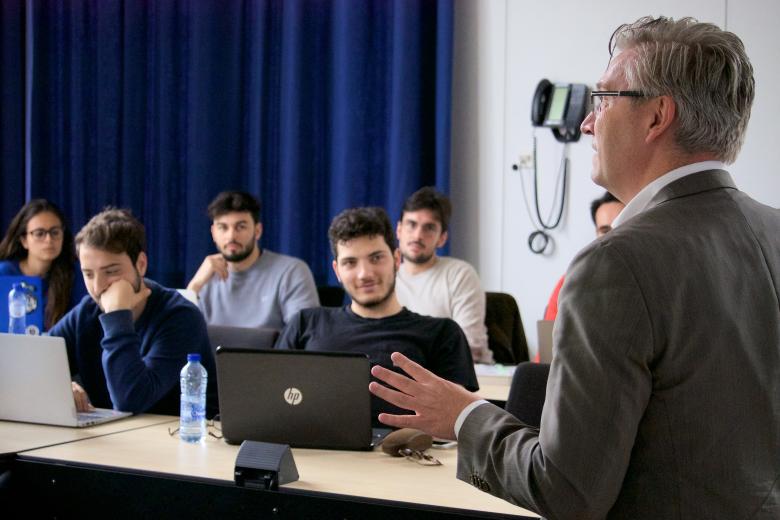 CES students with their Entrepreneurship professor in a UM classroom