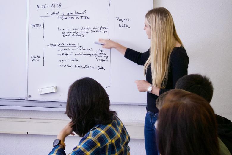 CES students and their Marketing professor in a UM classroom