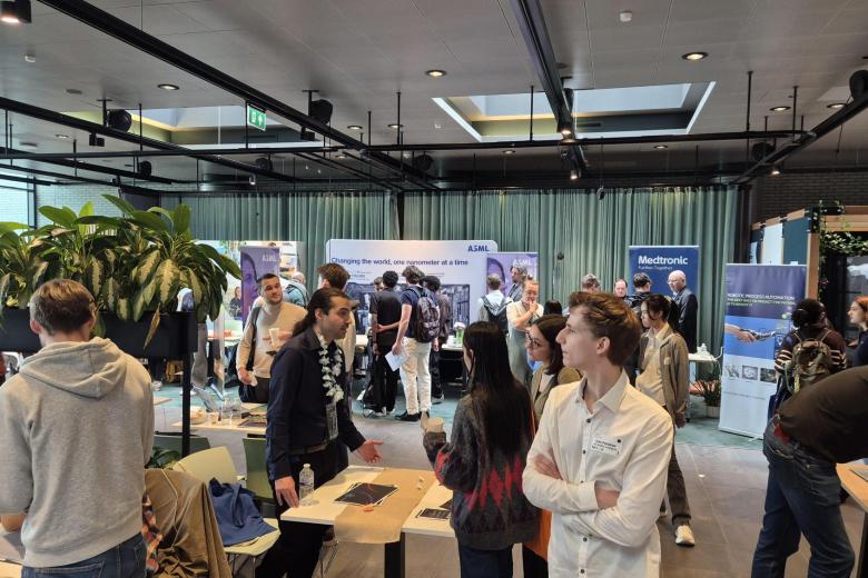 People hanging out at booths at a career fair