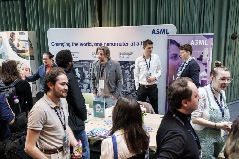 People hanging out at booth at career fair