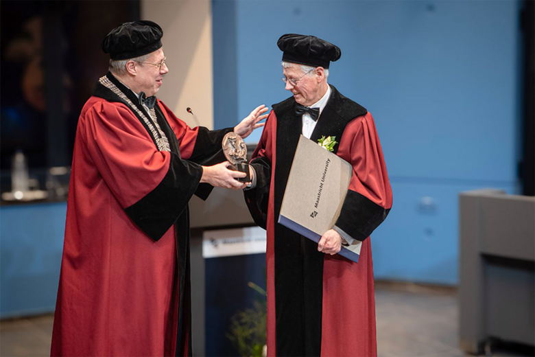 Professor handing over lecture to professor