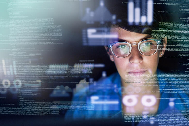 Young woman working with computer code