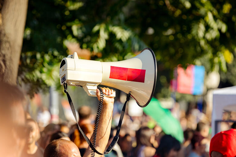 Person holding a megaphone at a demonstration